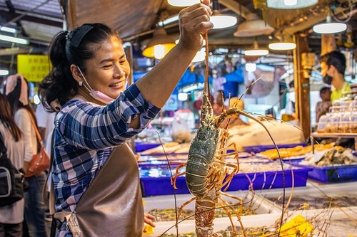 Women holding Lobster